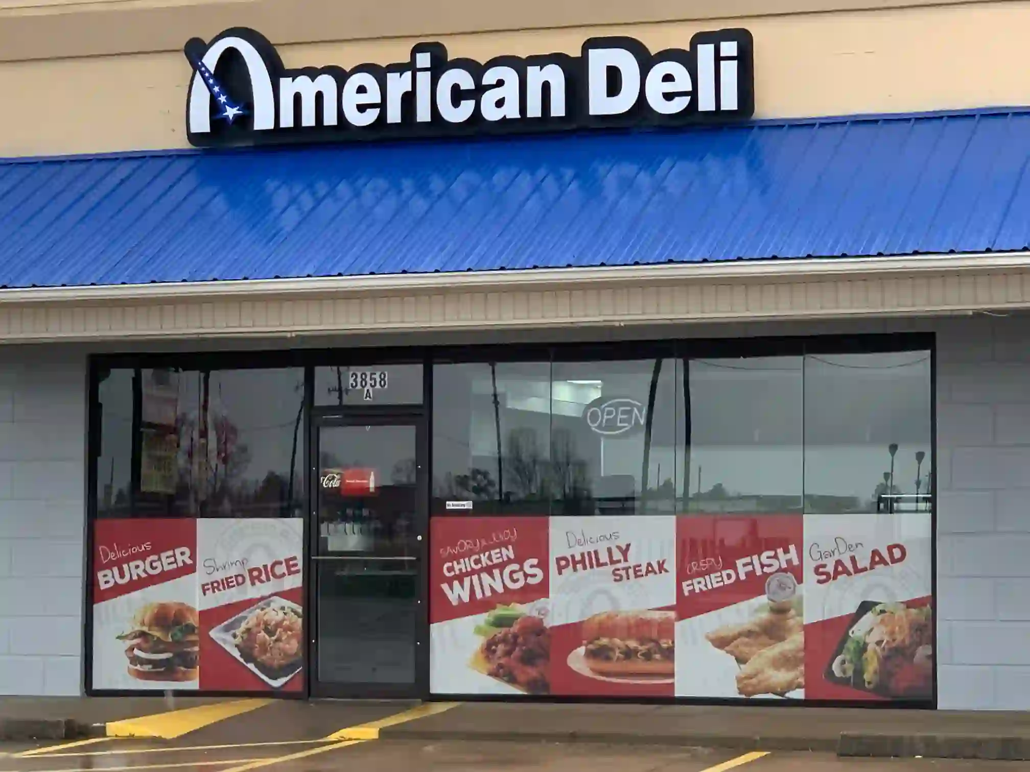 American Deli storefront showcasing menu items like burgers, fried rice, chicken wings, Philly steak, fried fish, and salad