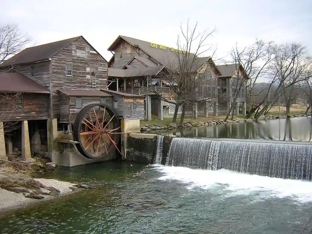 Historic Old Mill Restaurant with water wheel and scenic river view in Pigeon Forge, Tennessee